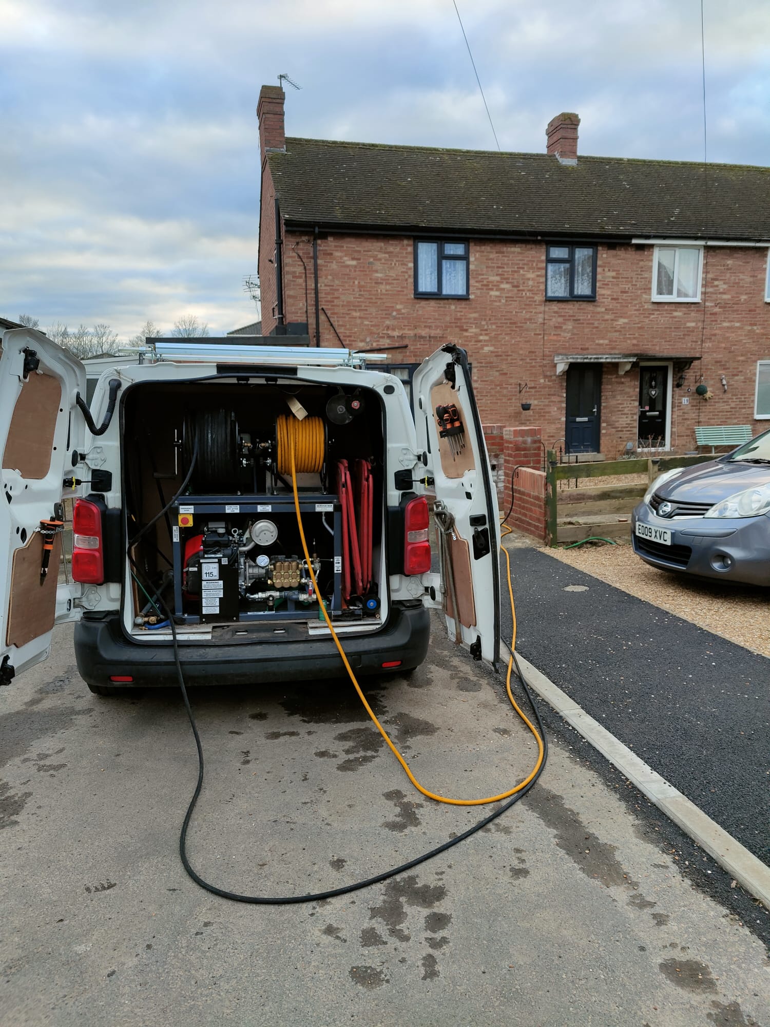 High pressure water jetting the drains to clear blockage and restore full flow